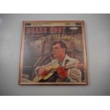 DUANE EDDY - A framed 12” LP cover for “Duane Eddy Plays Songs of Our Heritage” boldly signed “