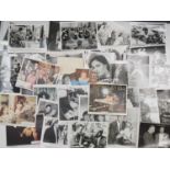 A large mixed quantity of assorted black/white film stills, lobby cards and publicity stills, to