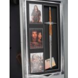 BRAVEHEART - A reproduction sword signed to the blade by Mel Gibson - mounted in a framed and glazed