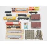 A quantity of boxed and unboxed HO gauge rolling stock by FLEISCHMANN, LILIPUT and others together