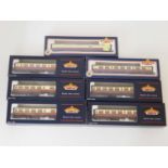 A group of BACHMANN OO gauge Bulleid and Thompson passenger coaches in BR crimson and cream livery -