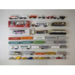 A group of boxed and unboxed HO gauge road vehicles and shipping containers by HERPA and others -