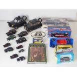 A mixed group of London Taxis items comprising assorted diecast models, two ceramic teapot Taxis , a