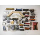 A group of O gauge wagons, bodies, spare parts and accessories by various manufacturers together