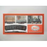 A MAMOD live steam 32mm scale RS1 Goods Train set comprising 0-4-0 steam tank locomotive in green,