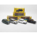 A group of 1:43 scale diecast models by BUDGIE, comprising Austin FX4 London Taxis in silver, black,