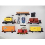 A group of PLAYMOBIL G scale trains and accessories to include a diesel locomotive and various