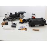 A BACHMANN G scale steam loco and an LGB tram car both for spares or repair together with some