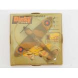 A DINKY Toys No 719 Supermarine Spitfire Mk II - camouflage green/brown body with 'RAF' roundels,