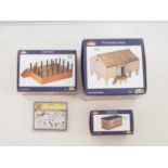 A group of BACHMANN SCENECRAFT O gauge resin buildings, comprising a 47-003 Cattle Dock, a 47-004