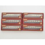 A group of AIRFIX OO gauge Cornish Riviera Centenary coaches in GWR chocolate and cream livery -