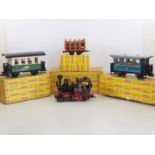 A group of vintage LGB G scale items comprising an 0-4-0 steam loco (incorrect box), two coaches (