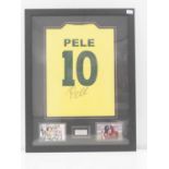 PELE - A framed and glazed replica Brazil Number 10 football shirt signed to the back by Pele - This