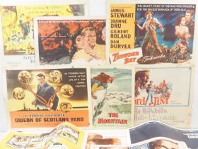 A small group of US half sheet movie posters for: THUNDER BAY (1953) Style A, THE MOUNTAIN (1956)