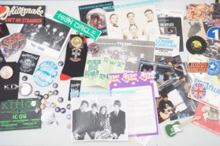 A large quantity of mixed music memorabilia to include badges, cloth patches, stickers,
