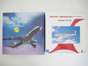 A pair of diecast model airplanes comprising a SCHABAK 1:250 scale Boeing 747-400 in British Airways