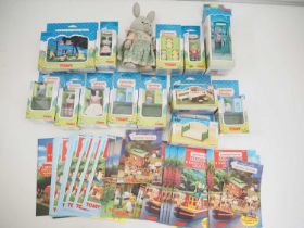 A group of TOMY SYLVANIAN FAMILIES comprising family members and accessories, a selection of hand