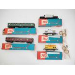 A group of TRIX OO gauge coaches and wagons as lotted in later TRIX boxes to include 2 x cleaning