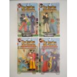 A complete set of four MCFARLANE 'The Beatles - Yellow Submarine Sgt Peppers Lonely Hearts Club