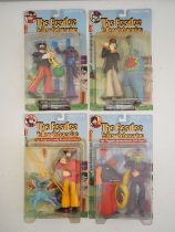 A complete set of four MCFARLANE 'The Beatles - Yellow Submarine Sgt Peppers Lonely Hearts Club