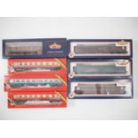 A group of BACHMANN and HORNBY OO gauge passenger coaches in various liveries comprising Thompson,