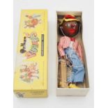 A vintage PELHAM PUPPET SM Singing Minstrel (without Banjo) in yellow snake charmer box - G in F/G