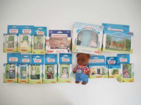 A group of TOMY SYLVANIAN FAMILIES comprising family members and accessories and a talking bear - VG