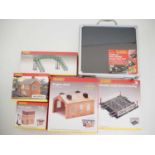 A mixed group of OO gauge HORNBY plastic kits comprising Footbridge, Water tower, Engine shed and