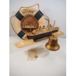 A group of Titanic souvenirs / replica memorabilia to include a scale model, lifebuoy, bell and