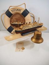 A group of Titanic souvenirs / replica memorabilia to include a scale model, lifebuoy, bell and