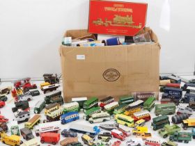 A large quantity of unboxed diecast cars, lorries and buses by various manufacturers together with a