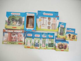 A group of TOMY SYLVANIAN FAMILIES comprising family members and accessories including a limited