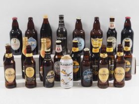 A Collection of 11 unopened Guinness bottles including 1982 Christmas Brew, Guinness Original,