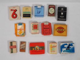 A collection of 20th century cigarette packets; mixed brands mostly empty, Chesterbrand, Gitanes,