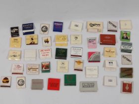 A group of matchbooks mostly British, most are empty some may contain matches to include a
