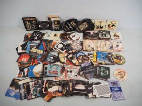 A large quantity of mostly GUINNESS related beer mats (Q)