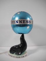 GUINNESS: Carlton Ware Sealion Lamp with revolving globe lampshade - in working order - c1963