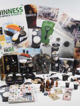 A collection of Guinness and related advertising collectables including two pairs of Guinness