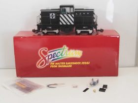 A SPECTRUM G scale Narrow Gauge 81897 GE 45-ton side rod diesel locomotive in Santa Fe black and