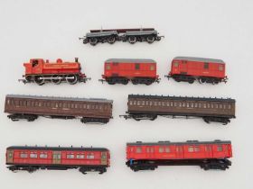 A group of kitbuilt and ready to run 1:76 scale London Underground stock including F stock and T