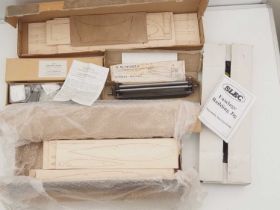 A quantity of wooden model aircraft parts together with jig kits for assembly of aircraft and two