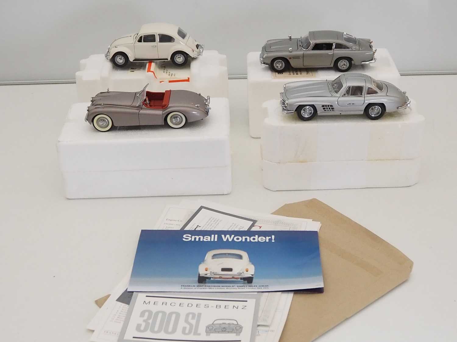 A group of FRANKLIN MINT and DANBURY MINT 1:24 scale diecast vehicles comprising: Volkswagen Beetle,
