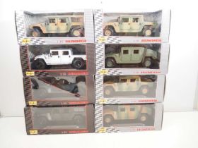 A group of MAISTO 1:18 scale diecast Hummers (Humvees) in various styles, both military and civilian