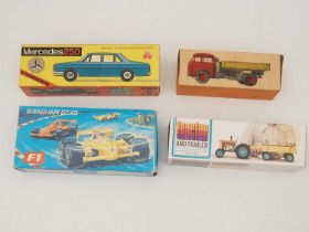 A group of vintage tinplate and plastic Czechoslovakian made toys comprising a tractor/trailer, a