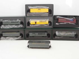 A group of SPECTRUM On30 scale American outline narrow gauge passenger cars in various liveries (one