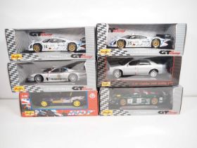 A MAISTO trade box containing a mixed selection of cars mostly GT racing examples - VG/E in VG boxes
