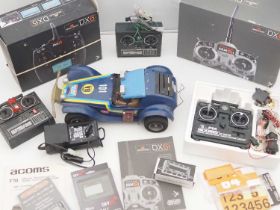 A large scale radio control buggy together with several RC controller systems - G/VG in F/G boxes (