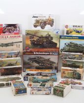 A group of unbuilt plastic kits for military vehicles - mostly in 1:72 scale - by ITALERI, AIRFIX