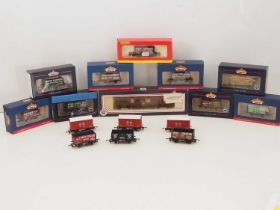 A group of OO gauge wagons by BACHMANN and HORNBY together with a BACHMANN parcels van converted