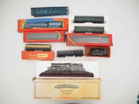 A group of TRIANG and HORNBY OO gauge rolling stock together with a pewter HORNBY locomotive and a